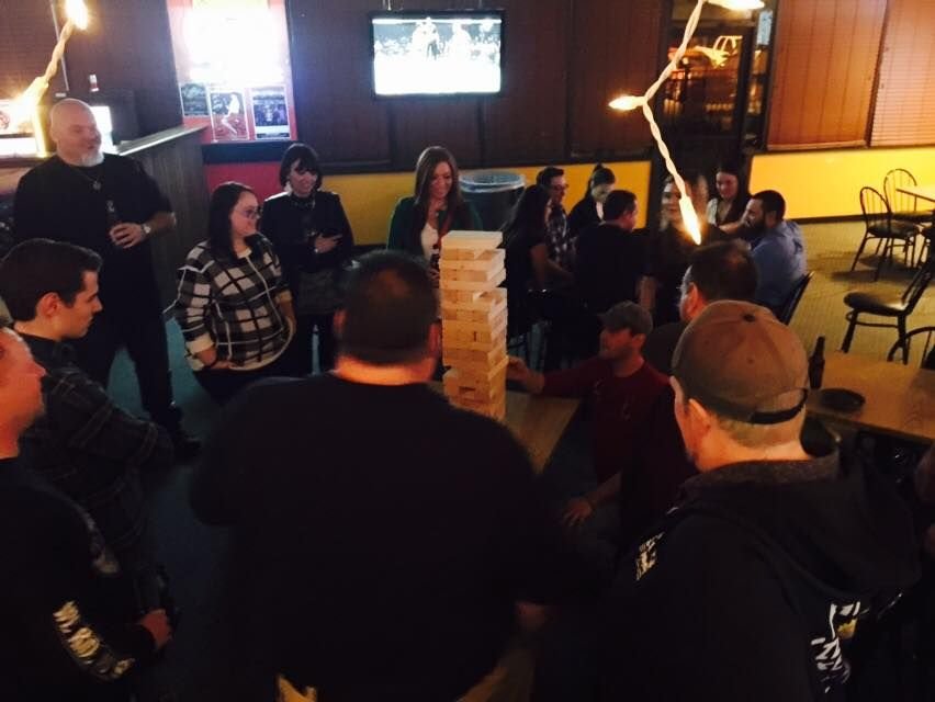 Friends playing giant Jenga